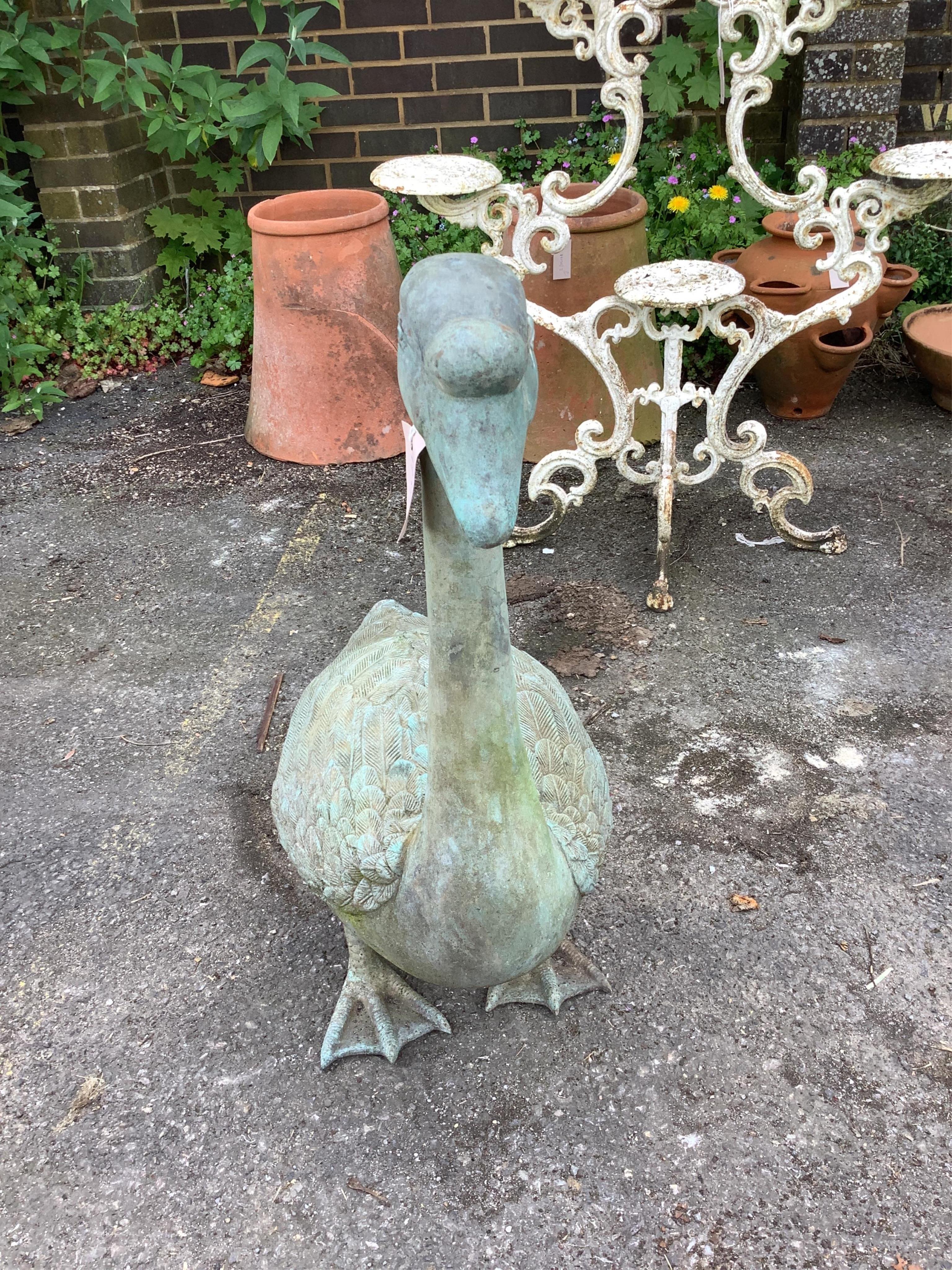 A cast patinated metal model of a goose, height 76cm